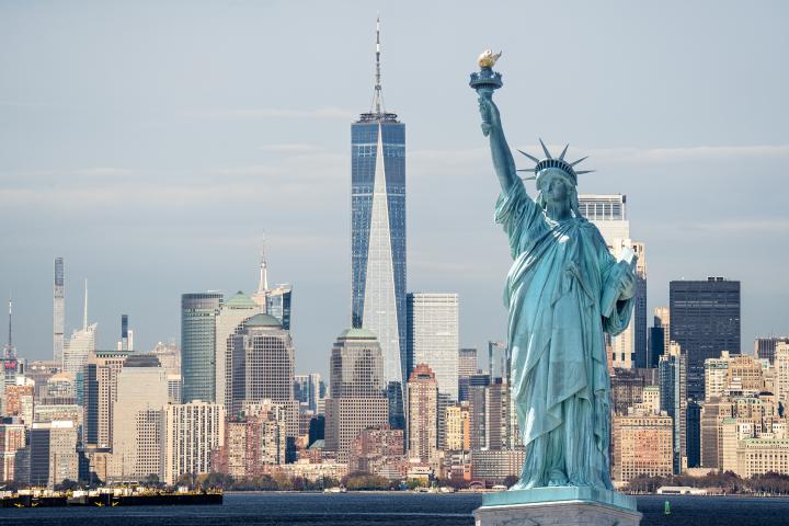 View of the statue of liberty with NYC skyline behind